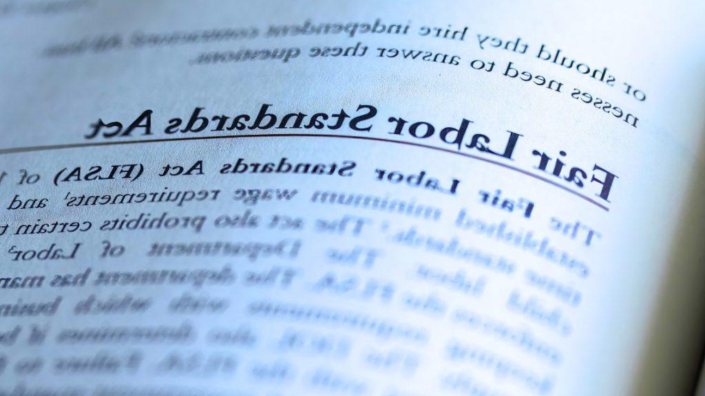 A page in a book talking about salary and the Fair Labor Standards Act (FLSA)